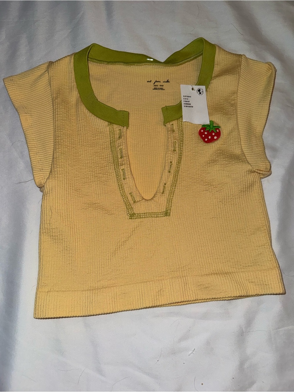 Urban Outfitters Kids Short Sleeve Knit Top in Pale Yellow with Green Trim